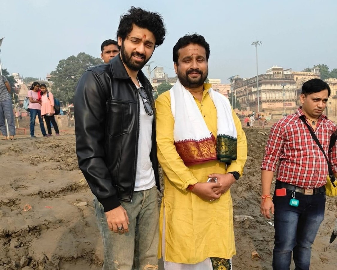 Family participating in puja with folded hands and devotion