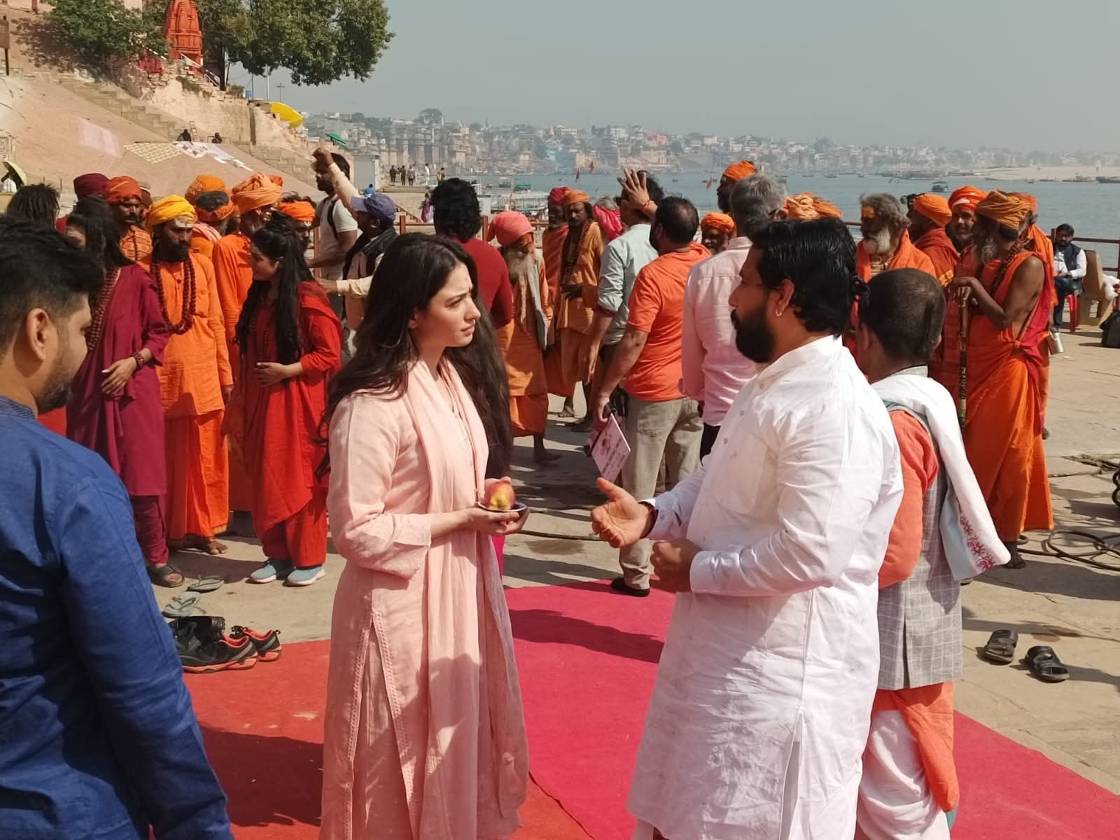Havan ceremony in progress with priest offering ahuti to sacred fire